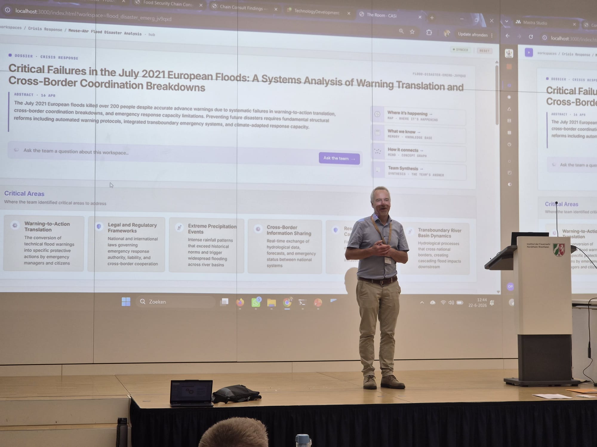 Bartel Van de Walle presenting a CASi Labs flood-coordination workspace at the Institut der Feuerwehr NRW
